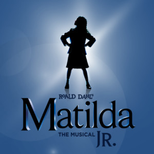 A silhouette of a girl with her hands on her hips stands in front of a blue backdrop. Text reads: Roald Dahl - MATILDA JR The Musical