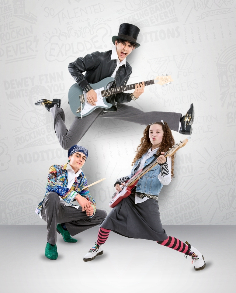Paxton, Daxton and Malaya strike rocker poses with their instruments.