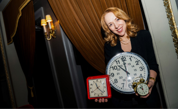 Rachel Peake with many clocks.