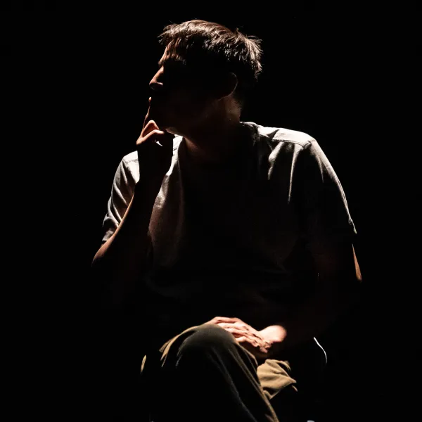 Pictured: Cliff Cardinal in HUFF. Photo by: Dahlia Katz. Directed by: Karin Randoja. Set and Costume Design by: Jackie Chau. Lighting Design by: Michelle Ramsay.