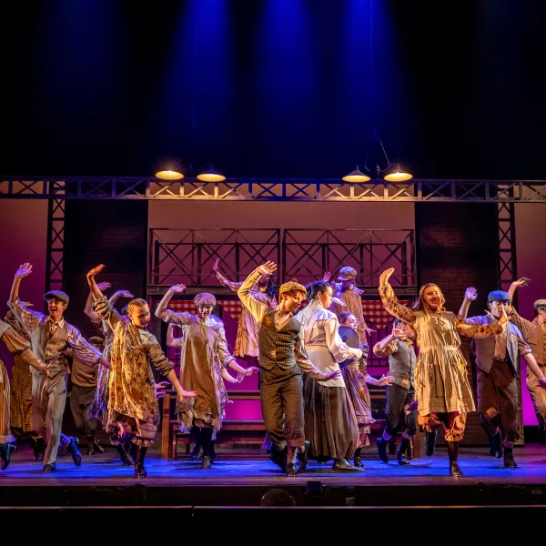 Pictured: Company members of Disney’s NEWSIES at the Grand Theatre. Directed by Ray Hogg. Music Direction by Matthew Atkins. Choreographed by Krista Leis. Set Design Consultant: Joshua Quinlan. Costume Design by Lisa Wright. Lighting Design by Echo Zhou周芷會. Sound Design by Emily Porter. Fight Director: Mike Dufays. Disability Consultant: Kristi Hansen. Stage Management by Melissa Cameron. Photography by Dahlia Katz.