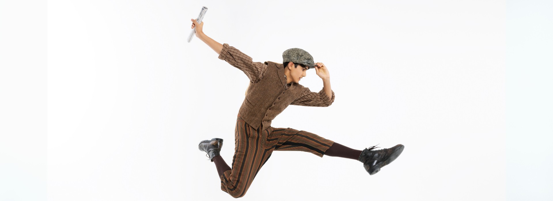 Newsie leaps through the air.